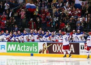 MINSK, BELARUS - MAY 9: Russia's Sergei Plotnikov #16 celebrates at the bech with teammates after a first period goal against Switzerland during preliminary round action at the 2014 IIHF Ice Hockey World Championship. (Photo by Andre Ringuette/HHOF-IIHF Images)


