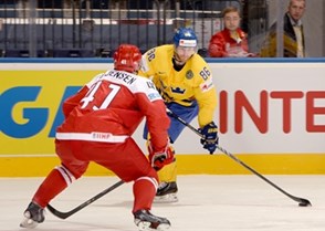 MINSK, BELARUS - MAY 10: Sweden's Linus Klasen #86 looks for a pass with pressure from Denmark's Jesper B. Jensen #41 during preliminary round action at the 2014 IIHF Ice Hockey World Championship. (Photo by Richard Wolowicz/HHOF-IIHF Images)

