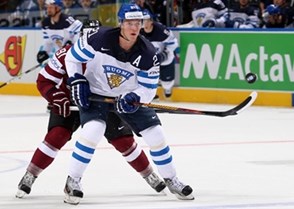 MINSK, BELARUS - MAY 10: Finland's Jori Lehtera #21 chips the puck forward during preliminary round action against Latvia at the 2014 IIHF Ice Hockey World Championship. (Photo by Andre Ringuette/HHOF-IIHF Images)


