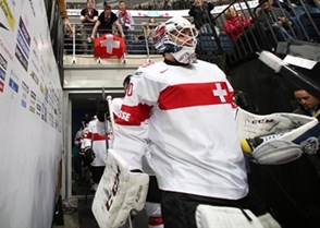 MINSK, BELARUS - MAY 10: Switzerland's Reto Berra #20 leads his team to the ice for preliminary round action against the U.S. at the 2014 IIHF Ice Hockey World Championship. (Photo by Andre Ringuette/HHOF-IIHF Images)

