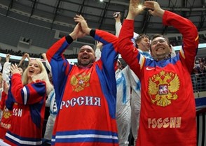 MINSK, BELARUS - MAY 12: Russian fans cheering on their team against the U.S. during preliminary round action at the 2014 IIHF Ice Hockey World Championship. (Photo by Andre Ringuette/HHOF-IIHF Images)

