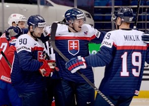 MINSK, BELARUS - MAY 14: Slovakia's Tomas Tatar #90 celebrates with Juraj Mikus #71 and Michel Miklik #19 after scoring Team Slovakia's first goal of the game during preliminary round action at the 2014 IIHF Ice Hockey World Championship. (Photo by Richard Wolowicz/HHOF-IIHF Images)

