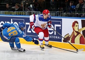 MINSK, BELARUS - MAY 14: Russia's Sergei Shirokov #52 skates with the puck while Kazakhstan's Roman Starchenko #48 defends during preliminary round action at the 2014 IIHF Ice Hockey World Championship. (Photo by Andre Ringuette/HHOF-IIHF Images)

