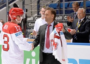 MINSK, BELARUS - MAY 15: Denmark's Morten Green #13 is presented with a jersey for playing his 257th game for Team Denmark during preliminary round action at the 2014 IIHF Ice Hockey World Championship. (Photo by Richard Wolowicz/HHOF-IIHF Images)

