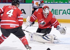 MINSK, BELARUS - MAY 16: Canada's James Reimer #34 reaches for a loose puck against Team Italy during preliminary round action at the 2014 IIHF Ice Hockey World Championship. (Photo by Richard Wolowicz/HHOF-IIHF Images)

