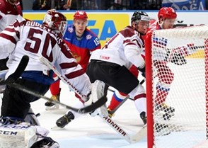 MINSK, BELARUS - MAY 17: Russia's Sergei Shirokov #52 scores a goal against Latvia's Kristers Gudlevskis #50 while Georgijs Pujacs #81 looks on during preliminary round action at the 2014 IIHF Ice Hockey World Championship. (Photo by Andre Ringuette/HHOF-IIHF Images)

