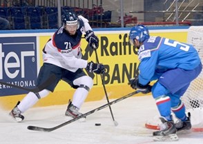 MINSK, BELARUS - MAY 17: Slovakia's Juraj Mikus #71 pulls the puck away from Italy's Christian Borgatello #50 during preliminary round action at the 2014 IIHF Ice Hockey World Championship. (Photo by Richard Wolowicz/HHOF-IIHF Images)

