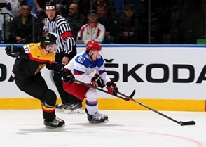 MINSK, BELARUS - MAY 18: Russia's Yevgeni Dadonov #63 skates with the puck while Germany's Justin Krueger #3 chases him down during preliminary round action at the 2014 IIHF Ice Hockey World Championship. (Photo by Andre Ringuette/HHOF-IIHF Images)

