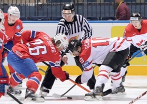 MINSK, BELARUS - MAY 20: Norway's Kristian Forsberg #26 faces off against Canada's Brayden Schenn #10 during preliminary round action at the 2014 IIHF Ice Hockey World Championship. (Photo by Richard Wolowicz/HHOF-IIHF Images)

